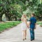 Engaged Couple Walking through Boone Hall