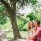 Couple Sitting on Tree at Boone Hall