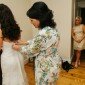 mom helping bride get ready